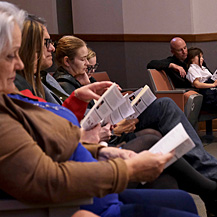 Audience members read along with Tracy K. Smith as she reads and discusses poems from “American Journal” at the Jean Lafitte Wetlands Acadian Cultural Center in Thibodaux, LA. December 14, 2018. Credit: Kevin Rabalais.